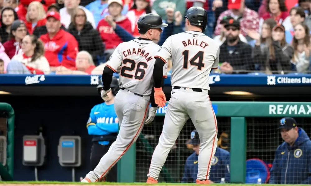Matt+Chapman+and+Patrick+Bailey+score+runs+for+the+San+Francisco+Giants+in+a+regular+season+game+versus+the+Philadelphia+Phillies.+The+2024+MLB+jerseys+have+been+criticized+for+reducing+the+size+of+the+letters%2C+and+curving+them+at+the+top+of+the+players+back.